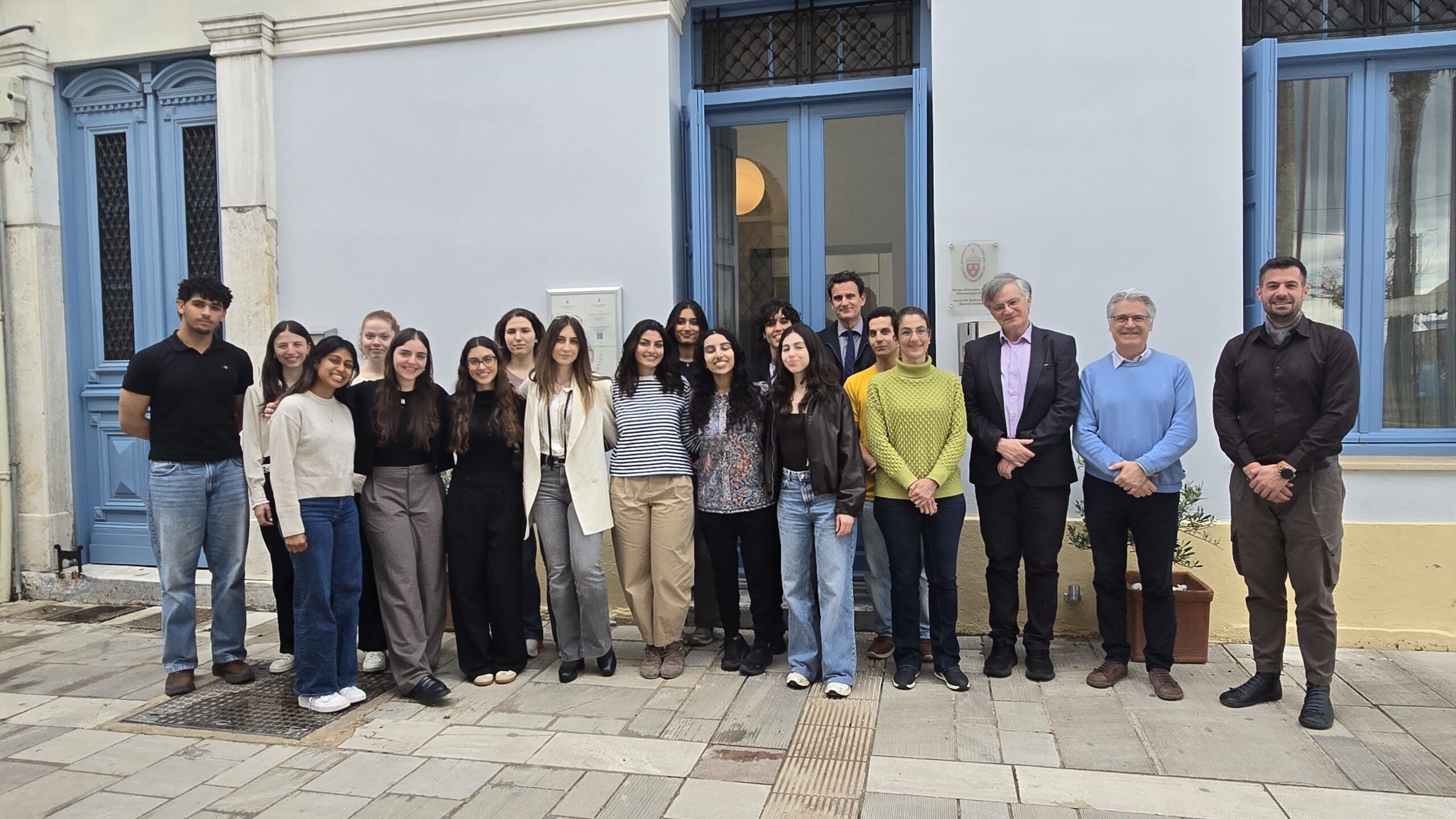 Group photo of students and faculty of the Genomic Medicine Course in Nafplio standing in front of the CHS Greece building.
