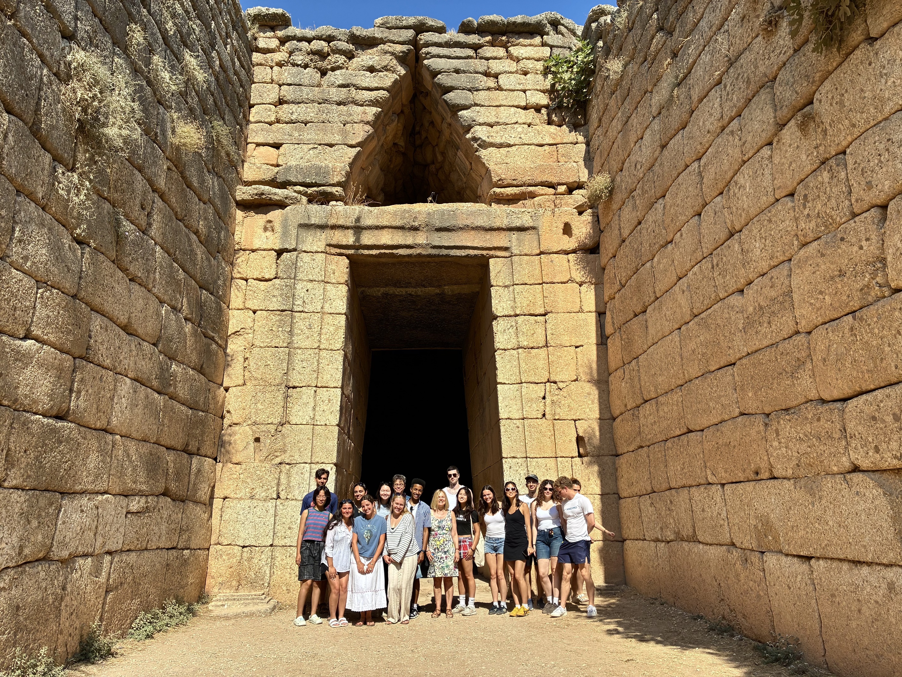 Harvard Summer School students in front of the Treasury of Atreus at Mycenae during an educational visit.