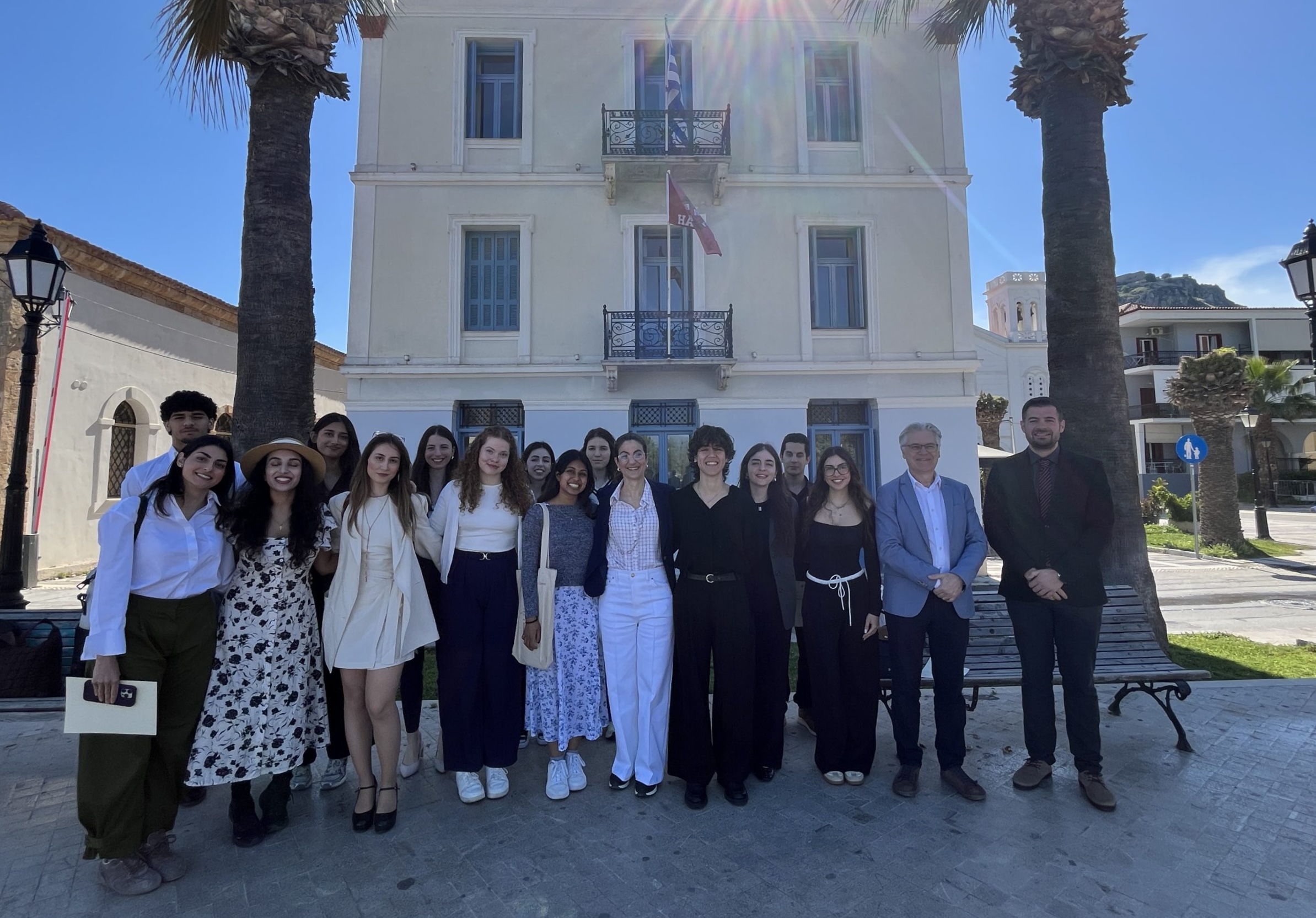 Participants and organizers gather for a group photo outside the CHS Greece building in Nafplio.