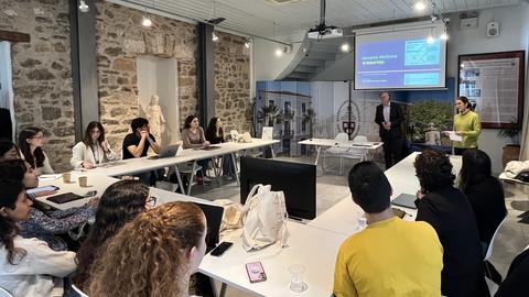 Participants attend a lecture and discussion session at CHS Greece in Nafplio.