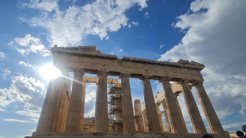 a majestic view of the Parthenon, the iconic ancient temple located on the Acropolis of Athens, Greece.