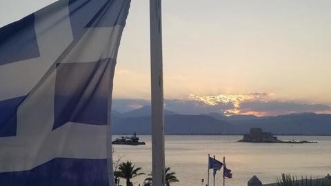 View of the Philhellene Square from the CHS Greece Fellows Room with the Greek flag on the foreground.