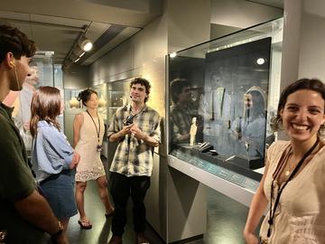 Lorenzo Levy leads a tour for Harvard Summer School students in the Cycladic collection galleries at the Museum of Cycladic Art.