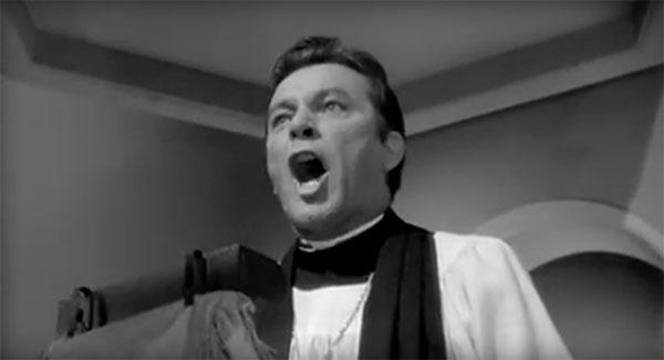 A Reverend delivering a speech.