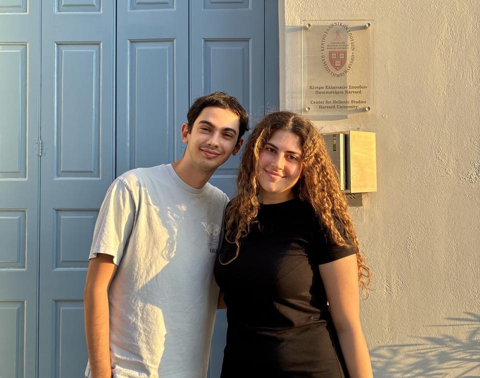 The two scholarship recipients standing outside the Center for Hellenic Studies in the evening light.