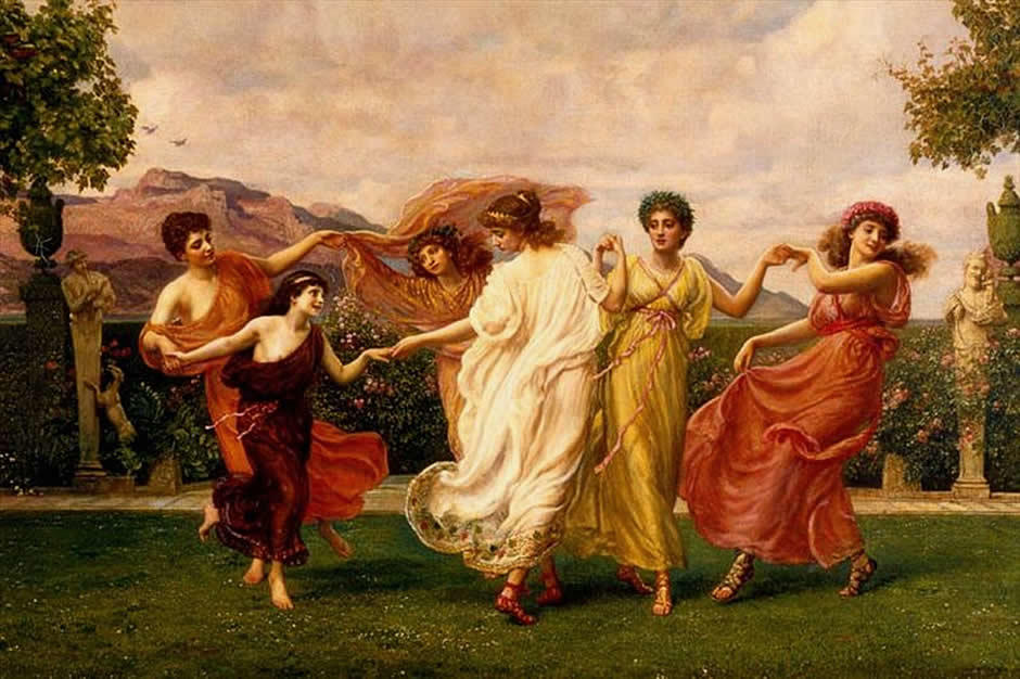 Six female figures dressed in flowing clothing dance with hands linked in an outdoor setting.